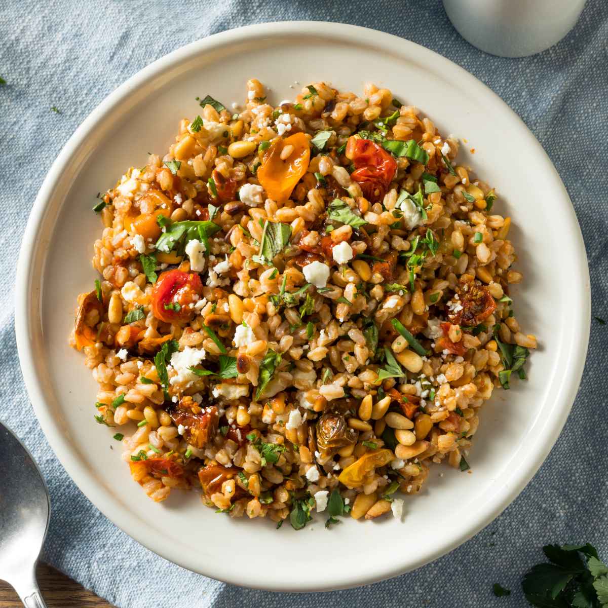 Farro salad served on a white plate.