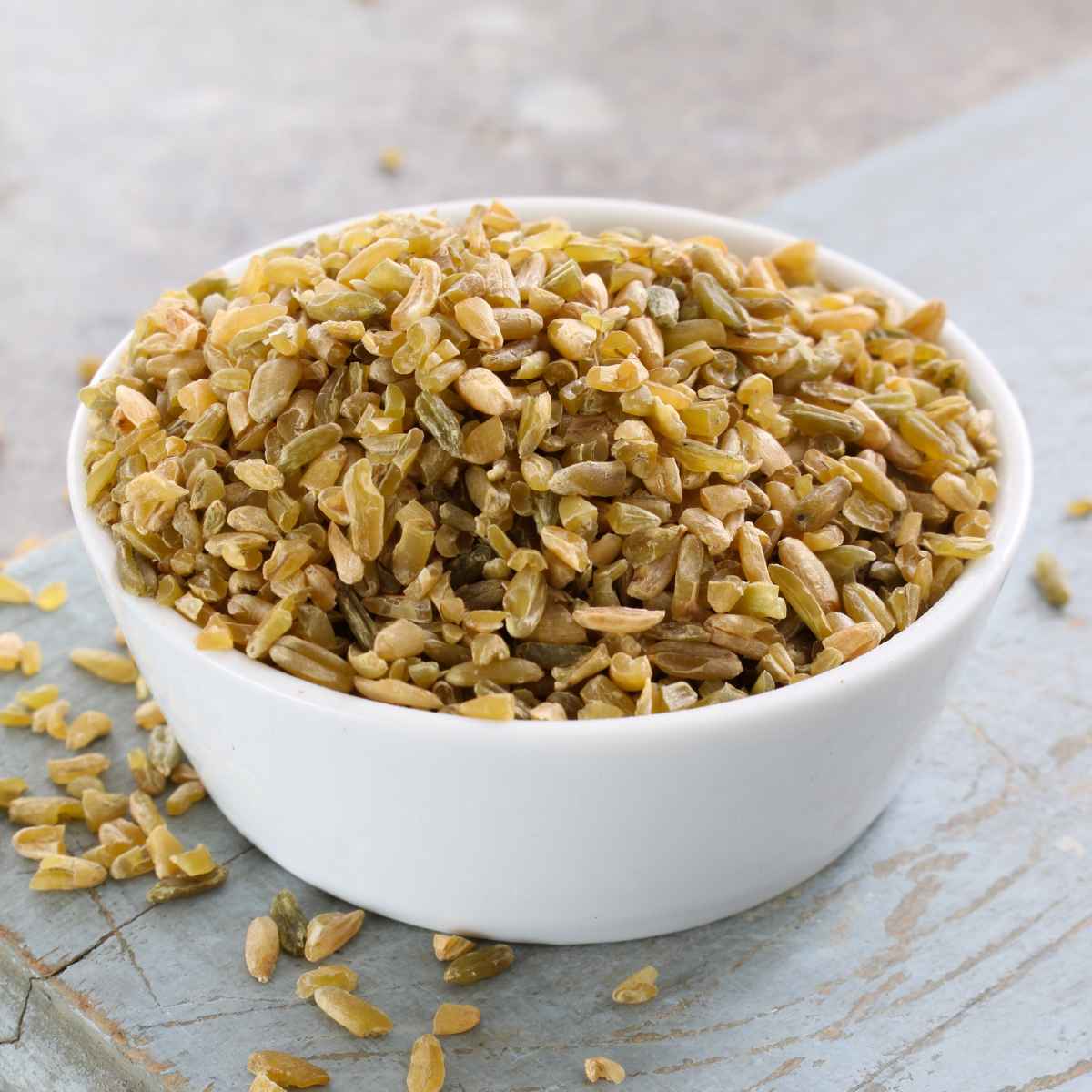 Freekh grains in a white bowl.