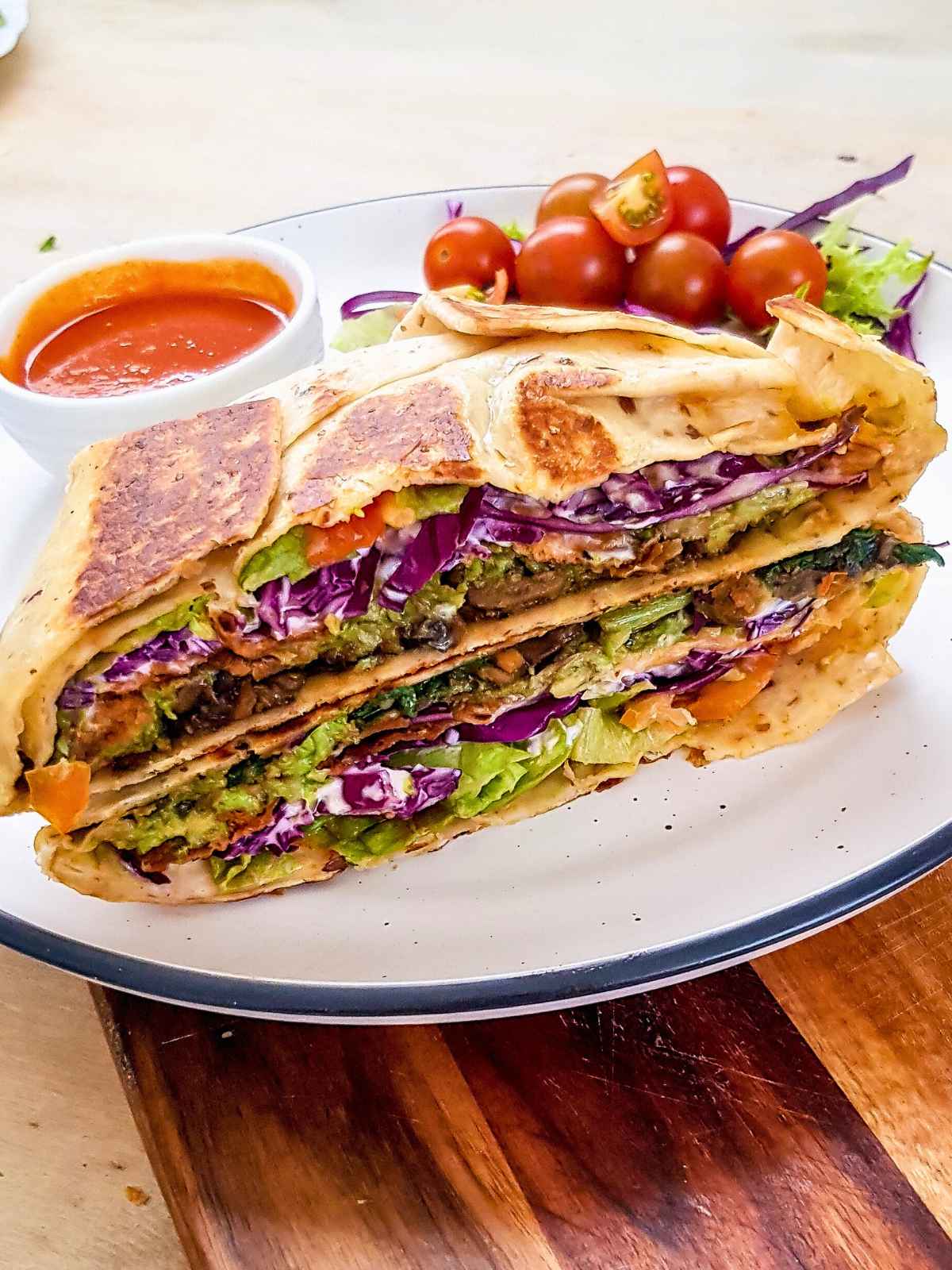 crunch wrap halved and placed on a plate.