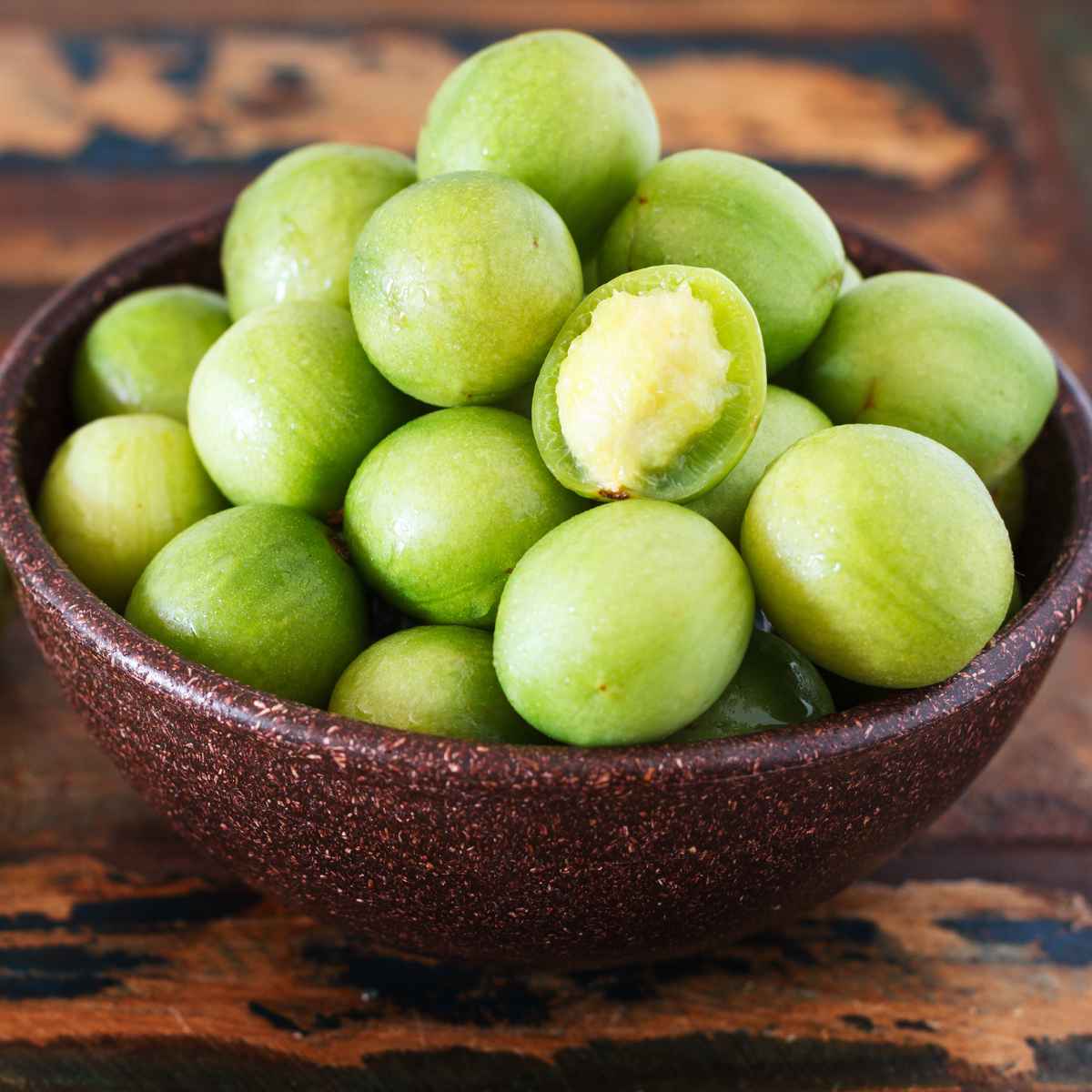 Umbu fruit in a wooden bowl.