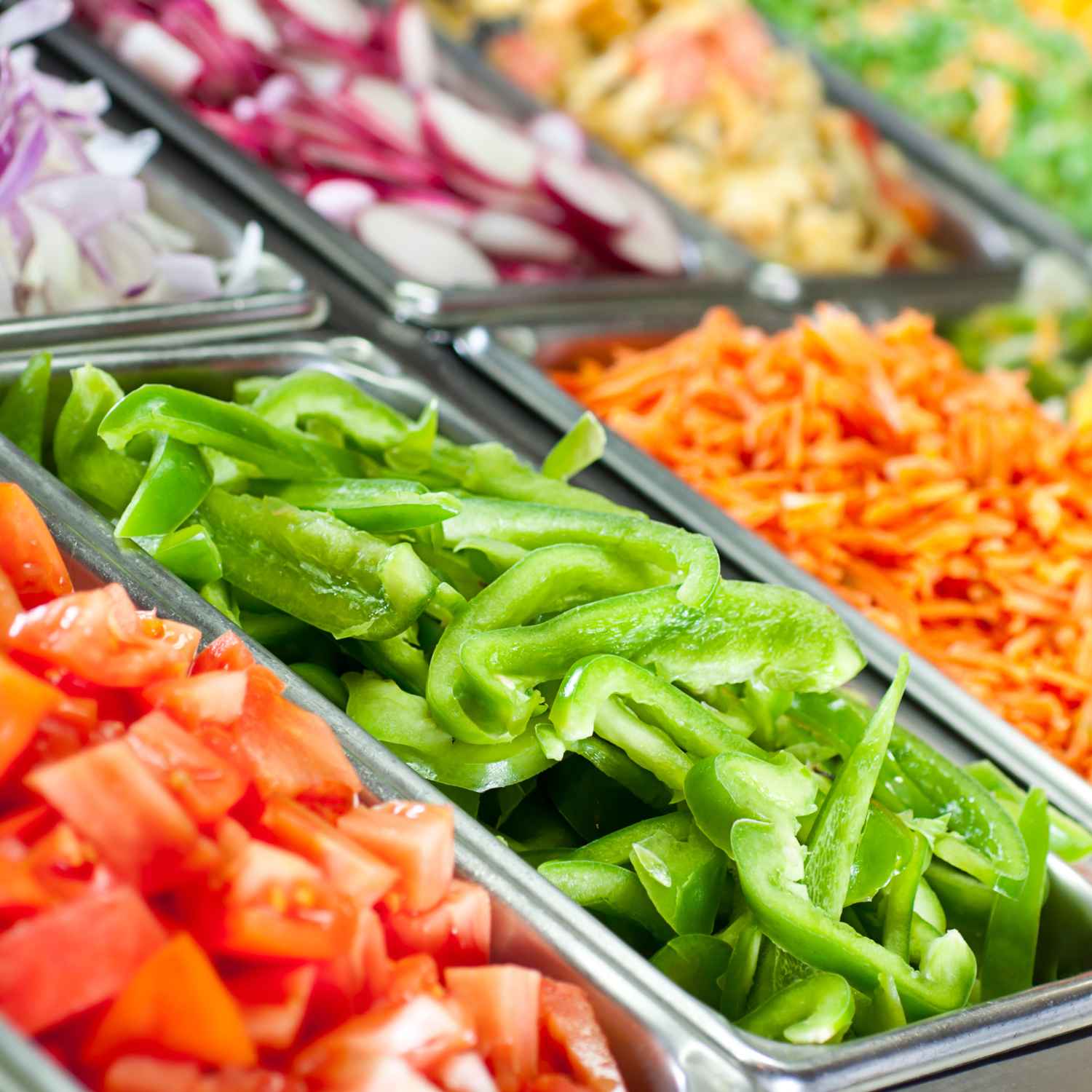 Vegan pizza toppings in containers.