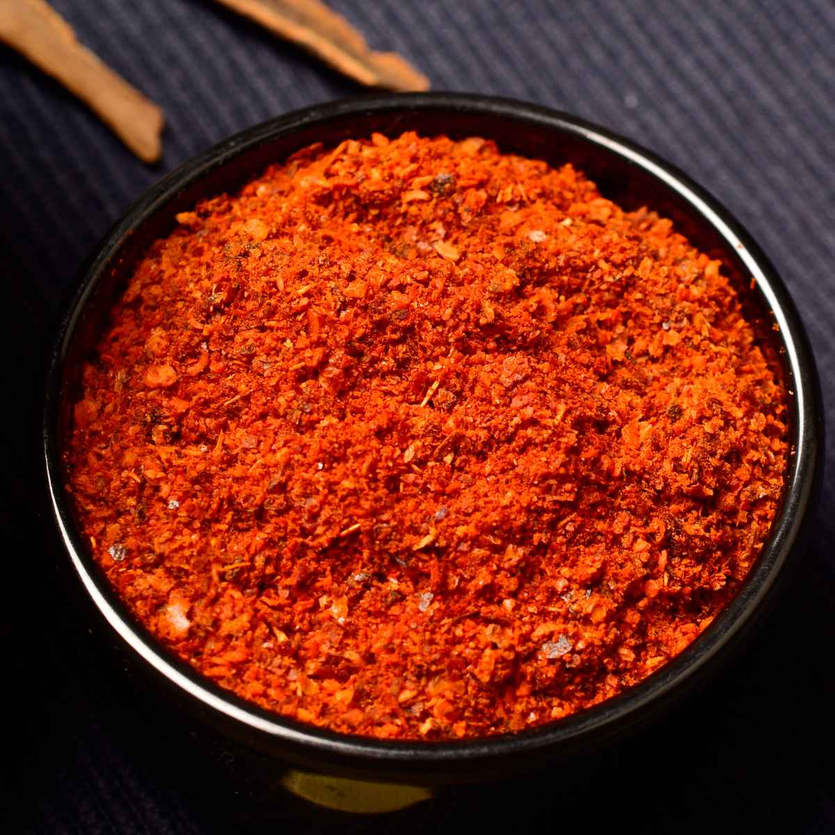 kashmiri mirch in a black bowl.