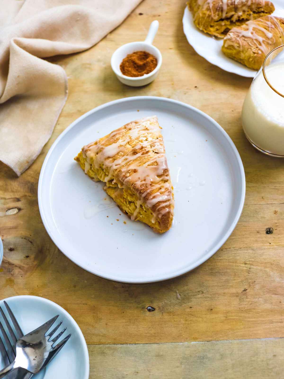 Eggless pumpkin scones served in a white plate.