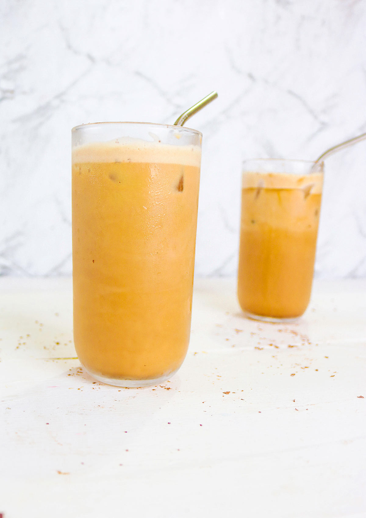 oat milk froth on top of the glass