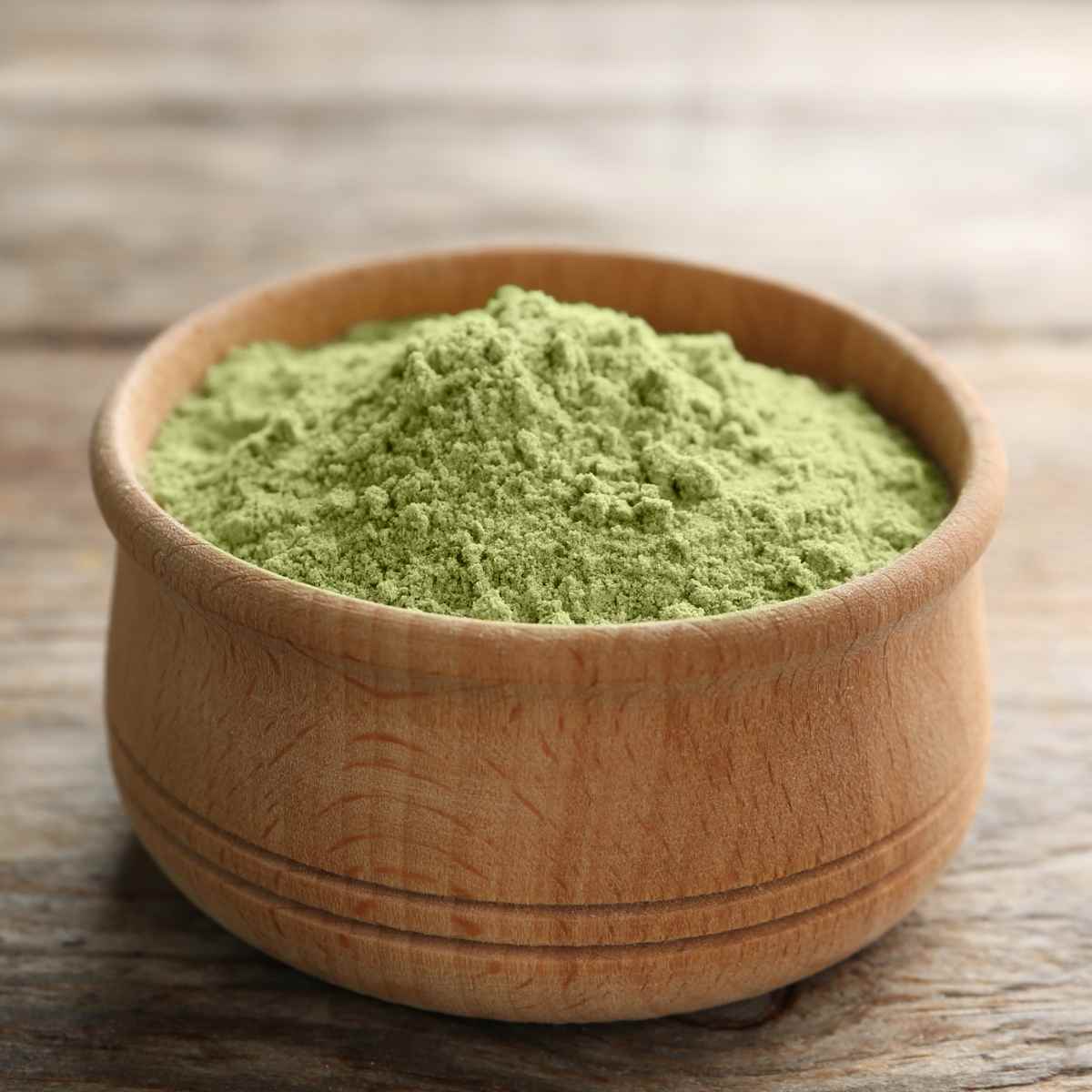 Lemongrass powder in a wooden bowl.