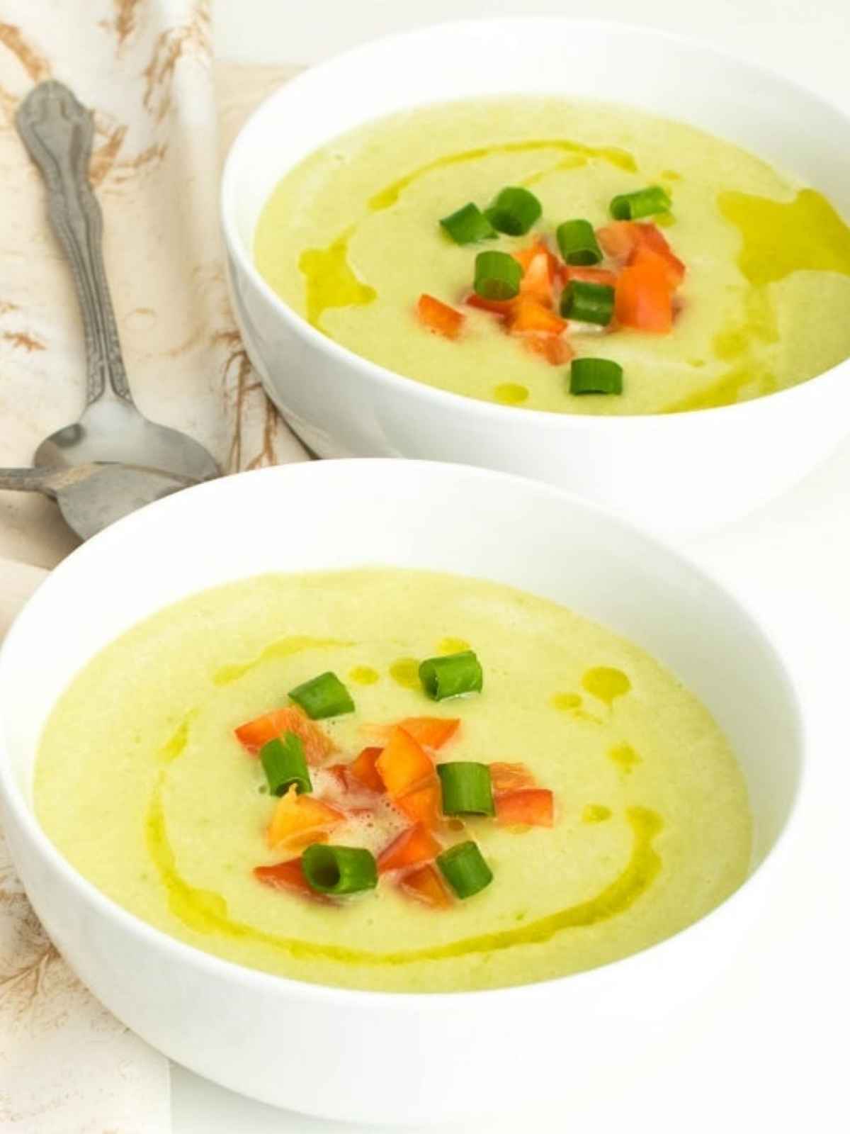 Cold soup served in two white bowls.