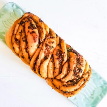 Vegan savory babka twisted bread served on a platter
